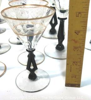 (24) Piece Set of Etched Crystal Glassware with Gilt Edge and Black Open work Base.  