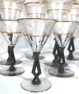 (24) Piece Set of Etched Crystal Glassware with Gilt Edge and Black Open work Base.  