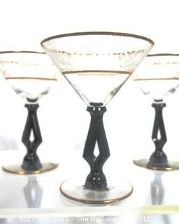 (24) Piece Set of Etched Crystal Glassware with Gilt Edge and Black Open work Base.  