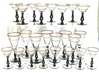 (24) Piece Set of Etched Crystal Glassware with Gilt Edge and Black Open work Base.  