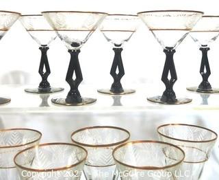 (24) Piece Set of Etched Crystal Glassware with Gilt Edge and Black Open work Base.  