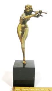 Cast Art Deco Statue of Female Nymph Playing Flute on Black Marble Base.  Measures approximately 9" tall. 