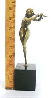 Cast Art Deco Statue of Female Nymph Playing Flute on Black Marble Base.  Measures approximately 9" tall. 