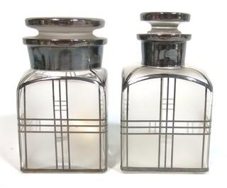 Two Vintage Art Deco Clear Crystal with Silver Overlay Vanity Bottles for Cotton Balls & Lotion.  They measure approximately 5" tall.  