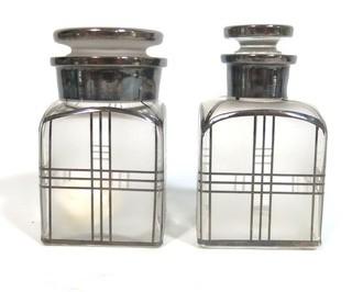 Two Vintage Art Deco Clear Crystal with Silver Overlay Vanity Bottles for Cotton Balls & Lotion.  They measure approximately 5" tall.  