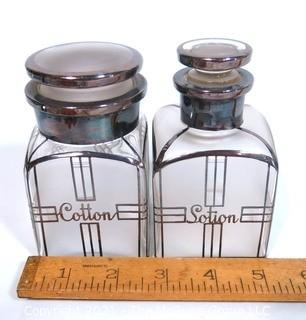 Two Vintage Art Deco Clear Crystal with Silver Overlay Vanity Bottles for Cotton Balls & Lotion.  They measure approximately 5" tall.  