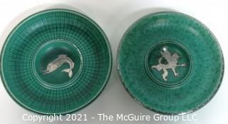 (2) Gustavsberg Argenta Stoneware Pottery Trays or Plates Designed by Wilhelm Kage with Silver Lion and Fish on Jade Green Base. Measures approximately 7" in diameter.