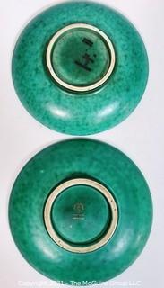 (2) Gustavsberg Argenta Stoneware Pottery Trays or Plates Designed by Wilhelm Kage with Silver Lion and Fish on Jade Green Base. Measures approximately 7" in diameter.