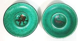 (2) Gustavsberg Argenta Stoneware Pottery Trays or Plates Designed by Wilhelm Kage with Silver Lion and Fish on Jade Green Base. Measures approximately 7" in diameter.