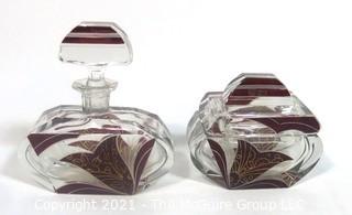 Karl Palda Bohemian Czech Art Deco Clear Cut Glass With Ruby Red Accents Vanity Set Including Perfume Bottle with Crystal Stopper and Trinket Box.  <br> <br> Many of the Karl Palda Bohemian Art Deco cut glass pieces in this auction were featured in the book “Collectible Bohemian Glass (1915 – 1945) Volume II” by Robert & Deborah Truitt.