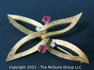 Vintage Ladies Brooch Made of 18k gold with (2) Rubies and (2) Diamonds.  Weighs approximately 10g