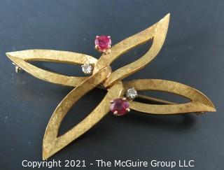 Vintage Ladies Brooch Made of 18k gold with (2) Rubies and (2) Diamonds.  Weighs approximately 10g