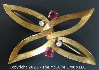 Vintage Ladies Brooch Made of 18k gold with (2) Rubies and (2) Diamonds.  Weighs approximately 10g