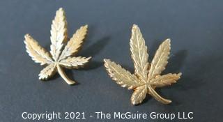 Pair of Vintage 1972 Gold Marijuana Leaf Earrings Made by Adams Apple Chicago.  Originally sold by the National Organization for the Reform of Marijuana Laws (NORML). 
