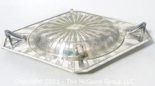 Two Piece Vintage Art Deco Silver Plate Serving Dish with Lid Made by Weidlich Bros with Geometric Design. Marked BMMTS for Britannia Metal Mounts.  Measures approximately 13" long