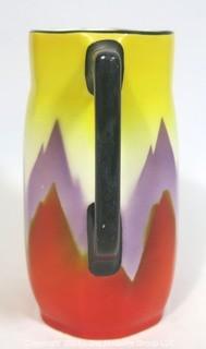 Vintage Ditmar Urbach Bohemian Czech Art Pottery Pitcher in Flame Pattern. Measures approximately 7" tall.