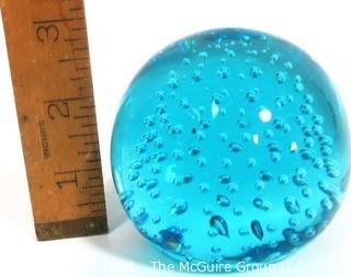 Blue Hand Blown Glass Paperweight.  Measures approximately 3" tall.  Small Chip on top.