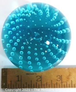 Blue Hand Blown Glass Paperweight.  Measures approximately 3" tall.  Small Chip on top.