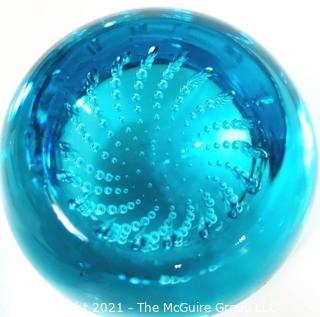 Blue Hand Blown Glass Paperweight.  Measures approximately 3" tall.  Small Chip on top.