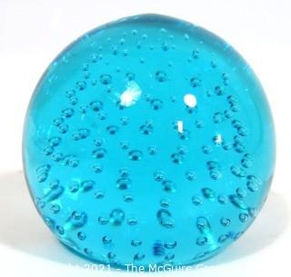 Blue Hand Blown Glass Paperweight.  Measures approximately 3" tall.  Small Chip on top.