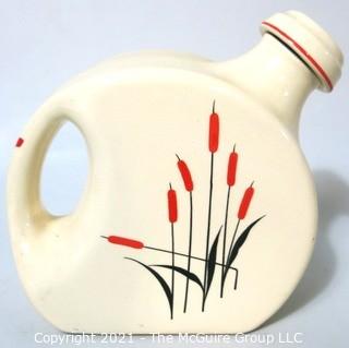  Vintage Disc Pottery Pitcher with Stopper Made by Sears & Roebuck in the Cat Tail Pattern.  Measures approximately 8" tall.