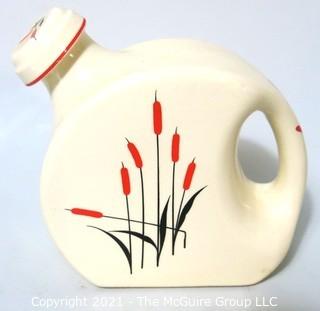  Vintage Disc Pottery Pitcher with Stopper Made by Sears & Roebuck in the Cat Tail Pattern.  Measures approximately 8" tall.