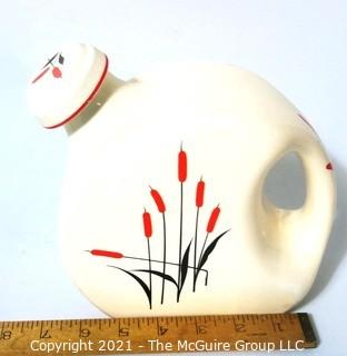  Vintage Disc Pottery Pitcher with Stopper Made by Sears & Roebuck in the Cat Tail Pattern.  Measures approximately 8" tall.