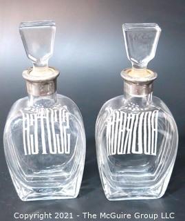 (2) Heavy Crystal Glass Scotch & Bourbon Liquor Decanters & Stoppers with Silver Overlay.  Some Splitting at Lip of Bottles. 