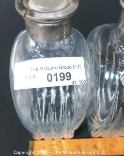 (2) Heavy Crystal Glass Scotch & Bourbon Liquor Decanters & Stoppers with Silver Overlay.  Some Splitting at Lip of Bottles. 