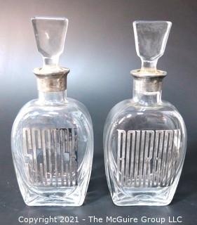 (2) Heavy Crystal Glass Scotch & Bourbon Liquor Decanters & Stoppers with Silver Overlay.  Some Splitting at Lip of Bottles. 