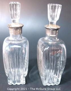 (2) Heavy Crystal Glass Scotch & Bourbon Liquor Decanters & Stoppers with Silver Overlay.  Some Splitting at Lip of Bottles. 