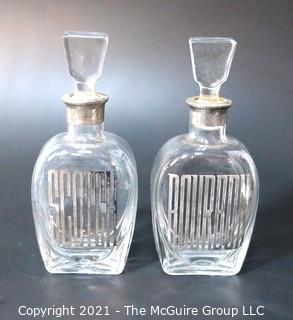 (2) Heavy Crystal Glass Scotch & Bourbon Liquor Decanters & Stoppers with Silver Overlay.  Some Splitting at Lip of Bottles. 