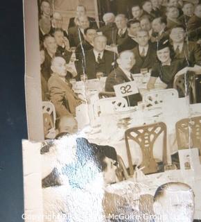 Vintage 1940 Unframed Black & White Photograph of  a Testimonial Dinner Dance to Honor Clifford Evans "Ears to the Ground" Column at The Hotel Bossert.   Measures approximately 20" long x 12" tall with some damage to edge.