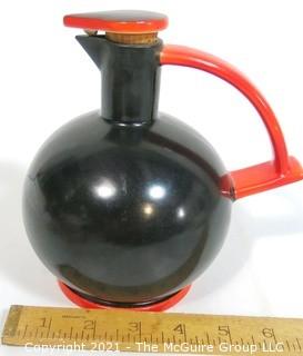 Vintage Black & Red Art Deco Pottery Jug with Cork Stopper.  Makers Mark on Bottom.  It measures approximately 6 1/2" tall.