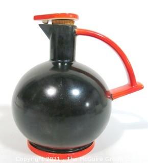 Vintage Black & Red Art Deco Pottery Jug with Cork Stopper.  Makers Mark on Bottom.  It measures approximately 6 1/2" tall.