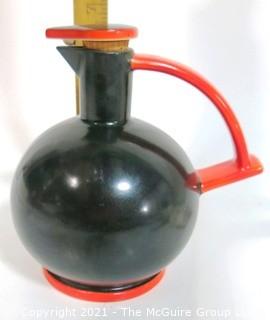 Vintage Black & Red Art Deco Pottery Jug with Cork Stopper.  Makers Mark on Bottom.  It measures approximately 6 1/2" tall.