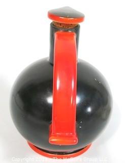 Vintage Black & Red Art Deco Pottery Jug with Cork Stopper.  Makers Mark on Bottom.  It measures approximately 6 1/2" tall.