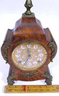 Antique 1904 Ansonia Calais Louis XIV Style 8 Day Mantel Clock in Faux Wood Grained Case.  It measures approximately  7 1/2 inches wide, 14 inches tall & 4 1/2 inches deep.