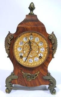 Antique 1904 Ansonia Calais Louis XIV Style 8 Day Mantel Clock in Faux Wood Grained Case.  It measures approximately  7 1/2 inches wide, 14 inches tall & 4 1/2 inches deep.