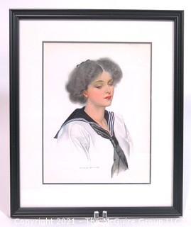 Framed Under Glass Lithograph of Woman by C. Coles Phillips.  Measures approximately 16" x 13".
