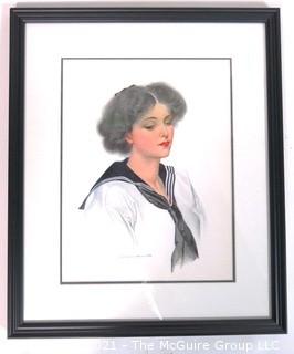 Framed Under Glass Lithograph of Woman by C. Coles Phillips.  Measures approximately 16" x 13".
