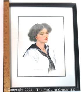 Framed Under Glass Lithograph of Woman by C. Coles Phillips.  Measures approximately 16" x 13".
