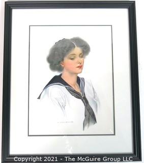 Framed Under Glass Lithograph of Woman by C. Coles Phillips.  Measures approximately 16" x 13".
