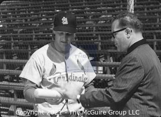 Baseball History: Lot includes 13 individual 35mm B&W negatives of Clifford Evans with several major league players including: H. Aaron, S. Musial, T. Kluszewski, F. Robinson, Bobby Bragan; Harvey Kuenn, Bobby Schantz; Fred Hutchinson; Brooks Lawrence and Al Cicotte. Also promotional flyer for Clifford Evans interviews with baseball players and a 1984 Baseball ID card.