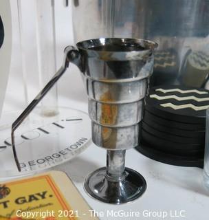 Collection of bar supplies: Ice Bucket; glasses; jigger; coasters; etc