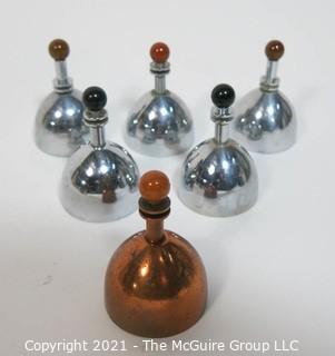 Set of 6 Mid Century Modern Chrome & Copper Dinner Service Hand Bells with Bakelite Decoration made by Chase. They Measure approximately 2 7/8" tall.