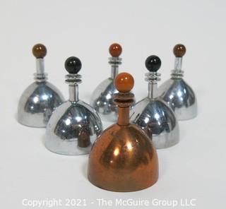 Set of 6 Mid Century Modern Chrome & Copper Dinner Service Hand Bells with Bakelite Decoration made by Chase. They Measure approximately 2 7/8" tall.