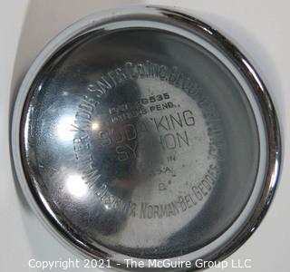 Chrome and Black Soda King Siphon Bottle Designed by Norman Bel Geddes for Walter Kidde Sales Co. Inc., Bloomfield, NJ
