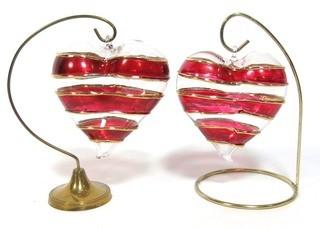 Two Large Hand Blown Clear with Red and Gold Overlay Venetian Glass Puffy Hearts with Stand.  Each measure approximately 4" wide.  