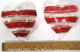 Two Large Hand Blown Clear with Red and Gold Overlay Venetian Glass Puffy Hearts with Stand.  Each measure approximately 4" wide.  